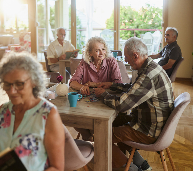 a group of people sitting at a table