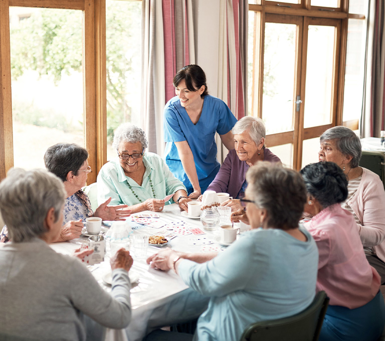 a group of people sitting at a table eating food